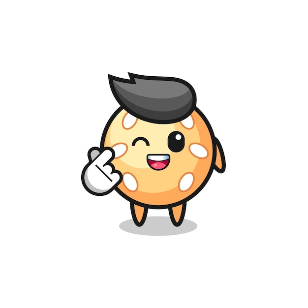 Personaje de bola de sésamo haciendo corazón de dedo coreano
