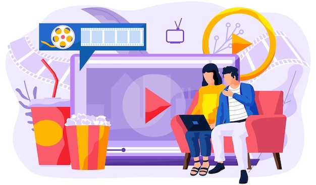 Personas junto a la pantalla grande con cubo de palomitas de maíz y bebidas.