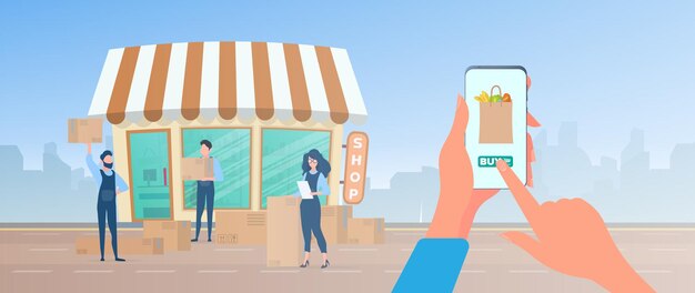 Pide comida en casa. La mano sostiene el teléfono inteligente.