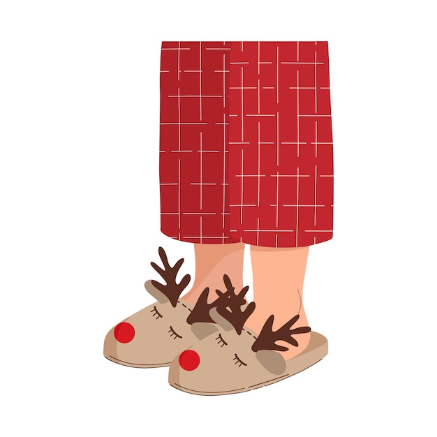 Piernas en pijama rojo con pantuflas cálidas. Divertidas pantuflas navideñas de ciervo. Pijama navideño de cuadros