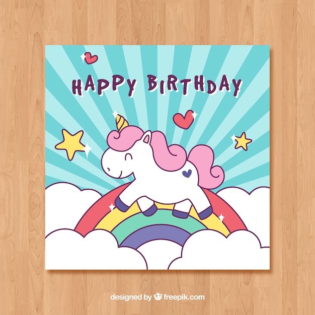 Plantilla de tarjeta  azul de cumpleaños con un unicornio