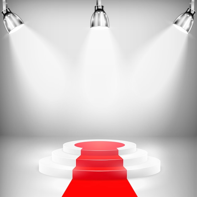Podio iluminado con alfombra roja.