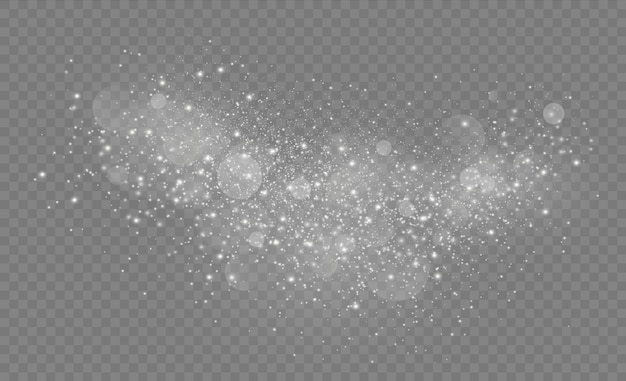 El polvo de estrellas chispea en una explosión. Las chispas blancas brillan con un efecto de luz especial. Brillantes partículas de polvo mágico.