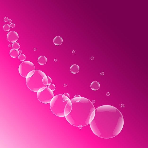 Pompas de jabón sobre fondo rosa