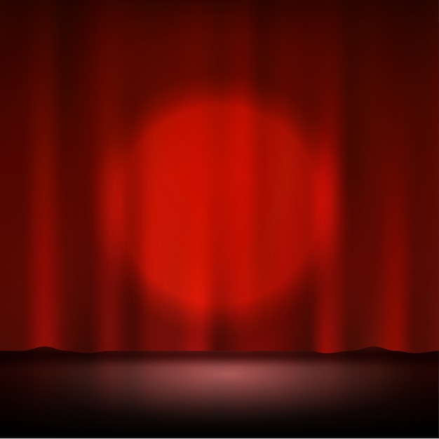 Proyector en el escenario de la cortina roja
