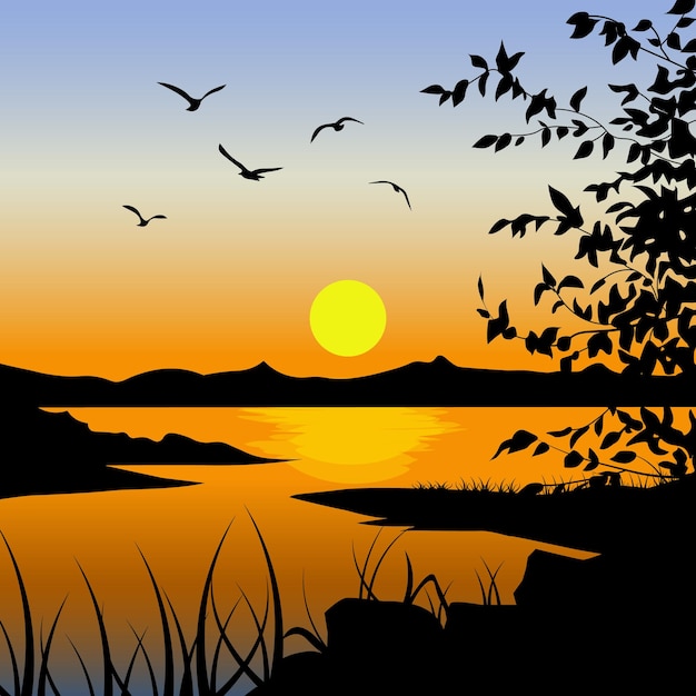 La puesta de sol sobre el lago con las siluetas de los pájaros contra el cielo