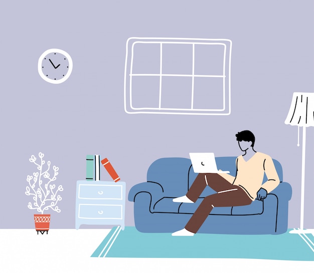 Quédese en casa, joven trabajando en la computadora portátil en casa