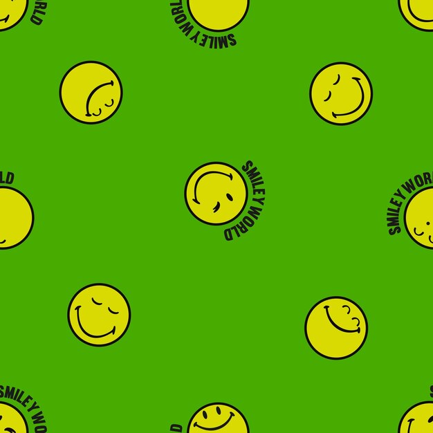 Repetición de emoticones de caras sonrientes en una superficie verde