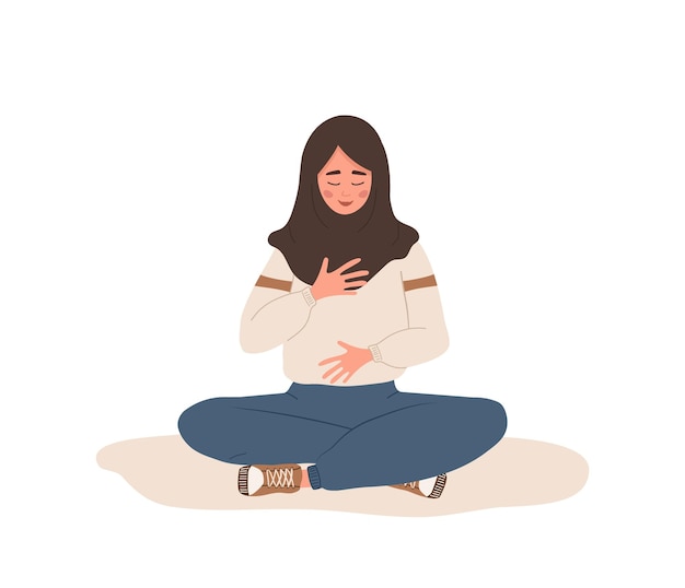 Respiración abdominal. Mujer árabe practicando respiración abdominal para relajarse.