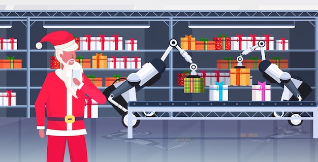 Santa claus controlando robots industriales cargando cajas de regalo presentes en la cinta transportadora feliz navidad feliz año nuevo celebración