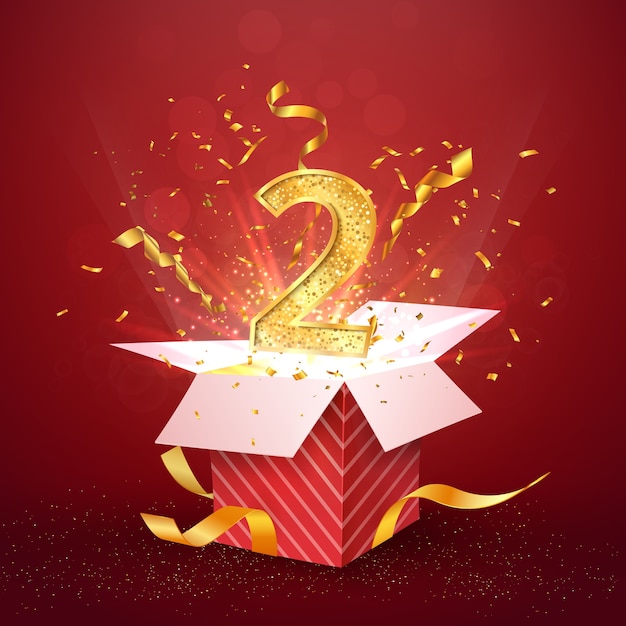 Segundo aniversario número y caja de regalo abierta con confeti de explosiones