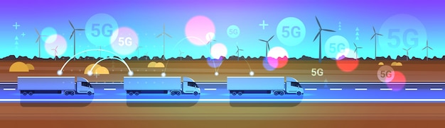 Semirremolques de carga de camiones que conducen en línea concepto de conexión del sistema inalámbrico turbinas eólicas paisaje fondo entrega logística transporte horizontal