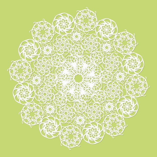 Una servilleta de encaje blanca sobre un fondo verde