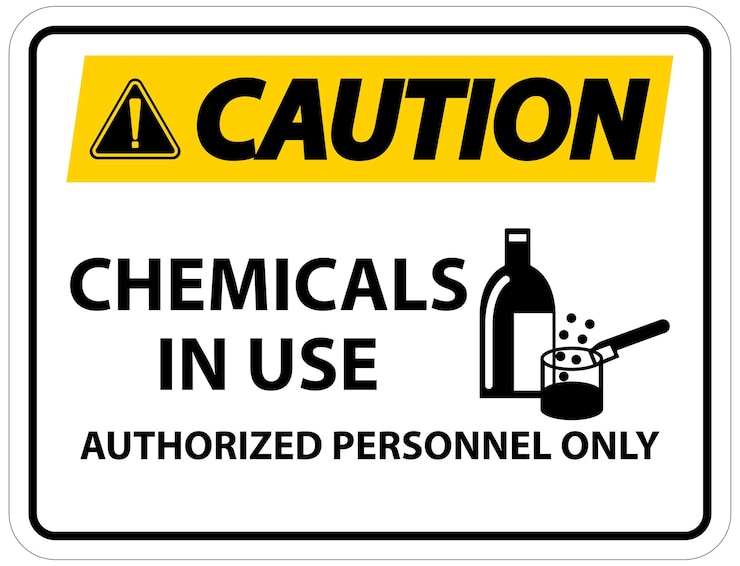 Vector signo de advertencia de productos químicos en uso en fondo blanco