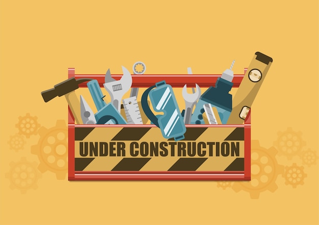 Bajo signo de construcción en caja de herramientas roja