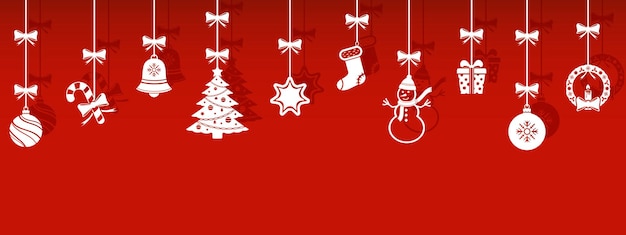 Símbolos de navidad colgando sobre fondo rojo.