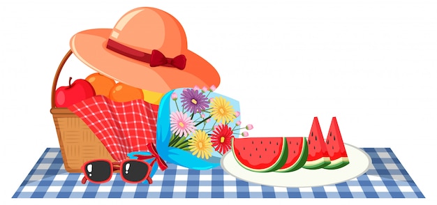 Tema de picnic con cesta de frutas y flores.