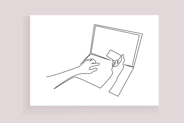 tenencia humana con tarjeta de crédito comprando en línea desde una computadora portátil
