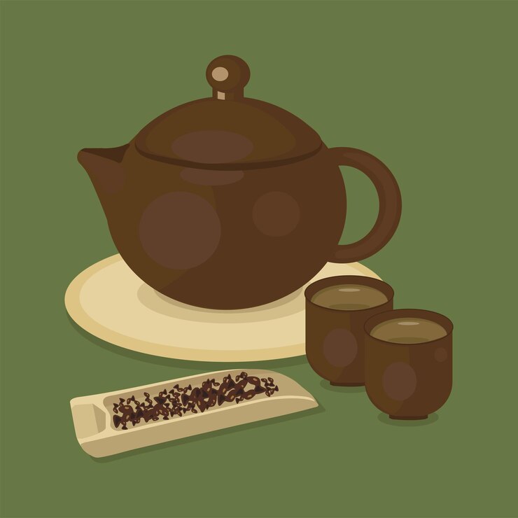 Tetera china con taza y hoja de té.