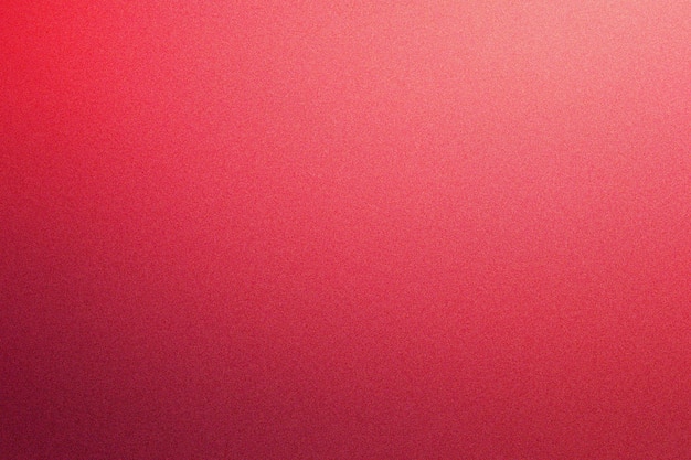 Textura granulada con gradiente colorido en tonos de rojo rosado y marrón