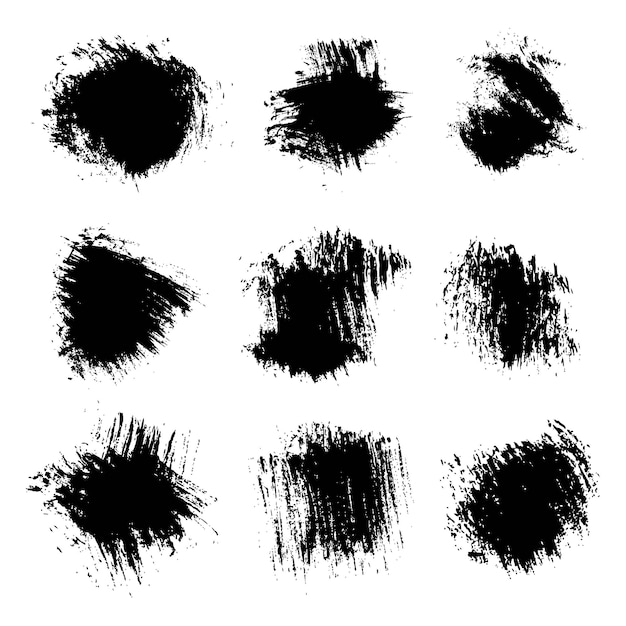 Trazos negros texturizados abstractos pintados con pincel seco aislados en un fondo blanco