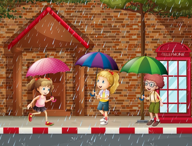 Tres niños bajo la lluvia