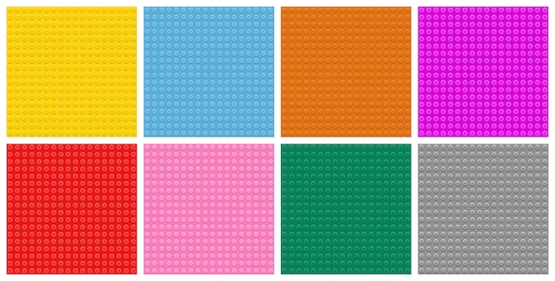 Una variedad de placas de base de bloques de construcción de juguetes de plástico en colores vivos brillantes, incluido el rojo, el amarillo, el verde, el rosa, el azul, el gris y el naranja, dispuestos en un diseño de cuadrícula, material de construcción creativo para niños.