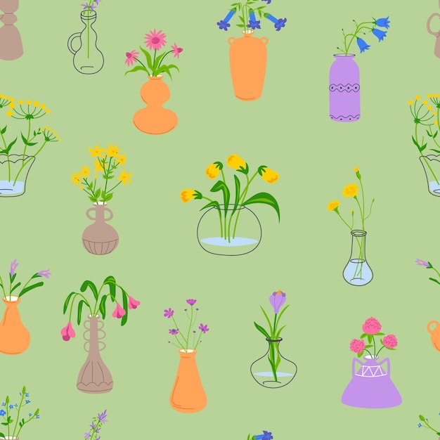 Vasos de flores sobre un fondo verde