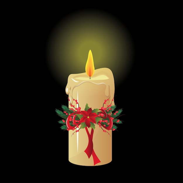 Vela de Navidad sobre fondo negro aislado.