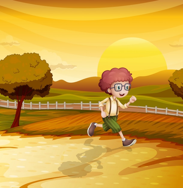 Una vista del atardecer con un niño corriendo