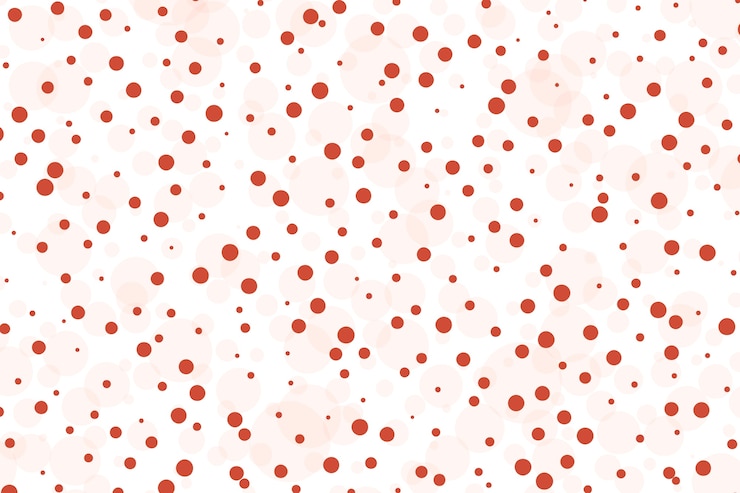Vector Gratis hand drawn red polka dot background