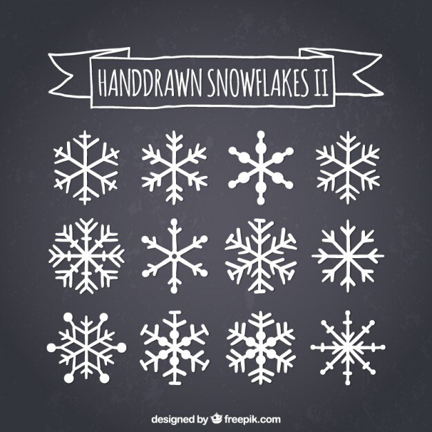 Vector Gratis hand drawn snowflakes on blackboard