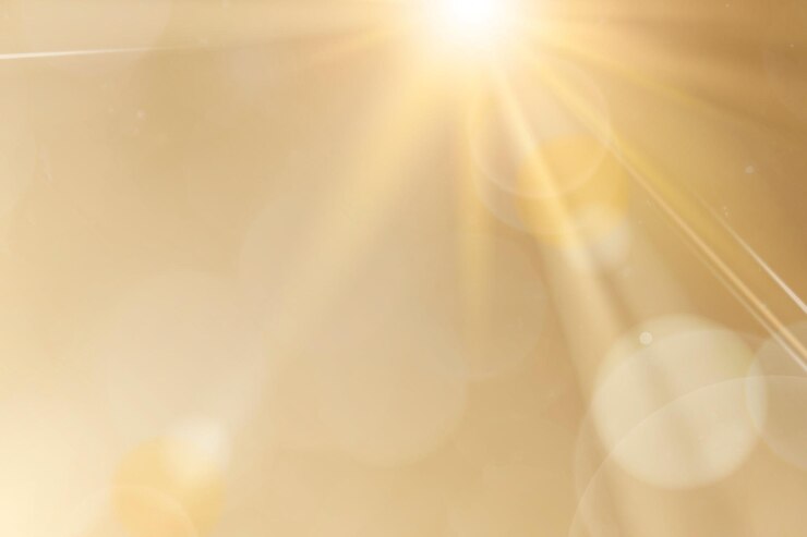 Vector Gratis natural light lens flare vector on gold background sun ray effect