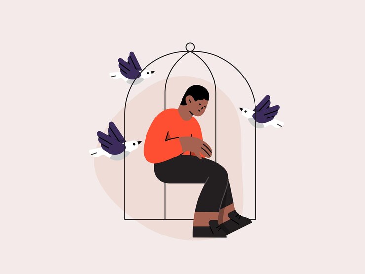 a man sits in a cage with birds in it