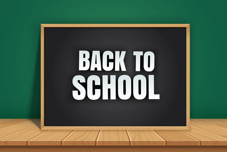 Vector back to school with black chalkboard on wooden table.