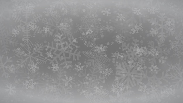 christmas background of snowflakes of different shapes sizes and transparency in gray colors