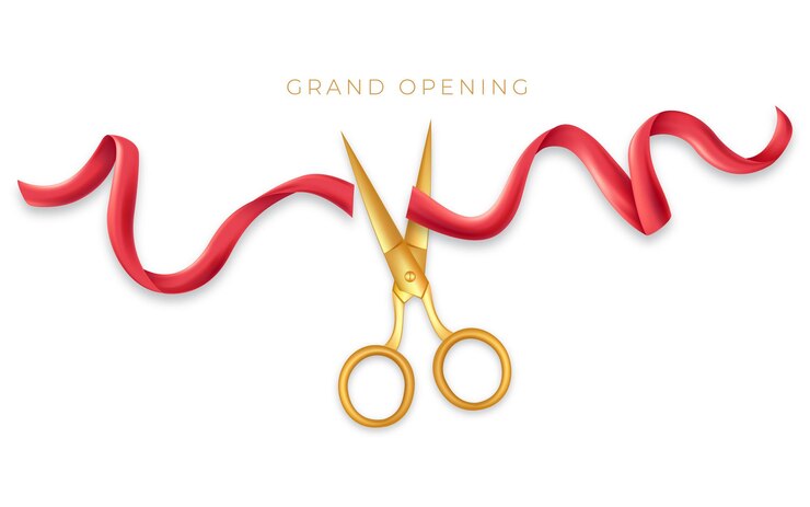 Grand opening with golden scissors cut the red ribbon