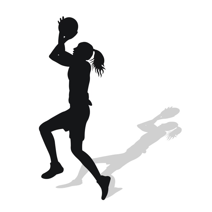 Image of black female silhouette of basketball player in a ball game