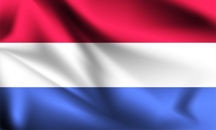 Vector netherlands flag blowing in the wind. part of a series. netherlands  waving flag.