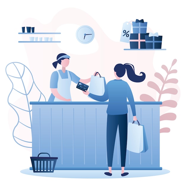 Woman buyer and female seller in store payment by card Female character with shopping bags in hands
