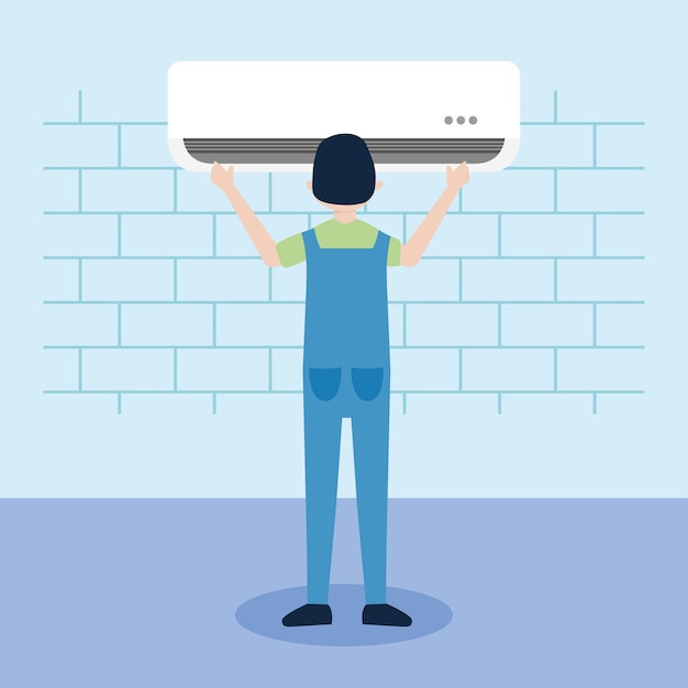 Worker installing an air conditioning on the wall