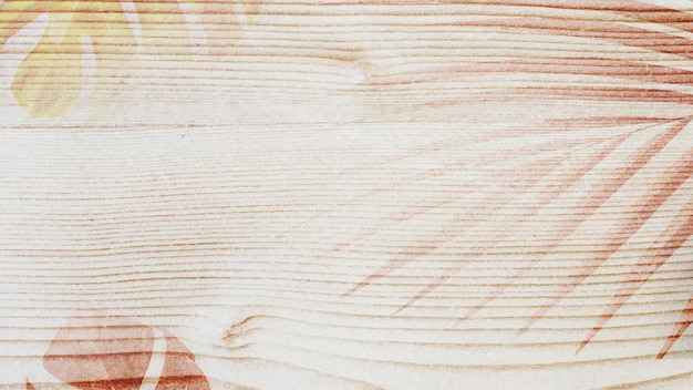 Blattdekoration auf schlichtem Holzdesign-Hintergrund