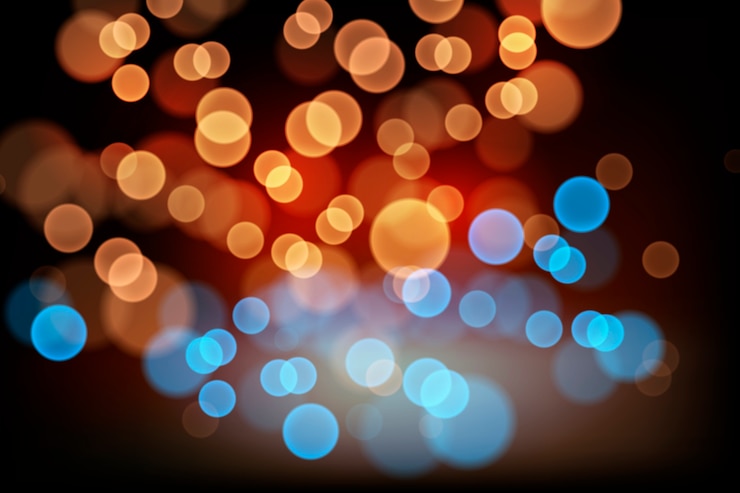 Kostenlose Vektor bokeh-lichteffekt auf dunkles hintergrundthema