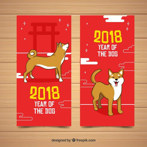 Chinesische neujahrsfahnen mit jungen hunden