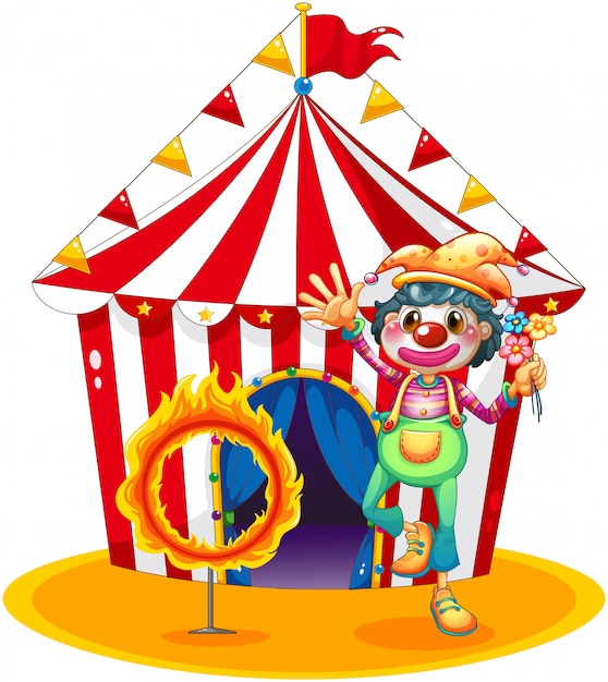 Ein feuerring und ein clown vor einem zirkuszelt