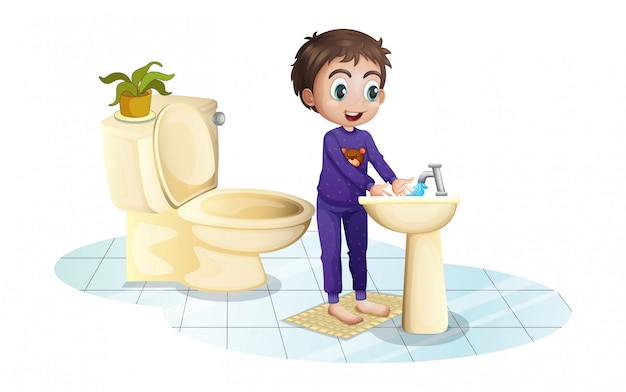 Ein Junge wäscht sich die Hände am Waschbecken