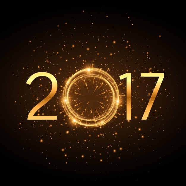 Golden 2017 text des neuen jahres mit glühenden glitzereffekt und feuerwerk