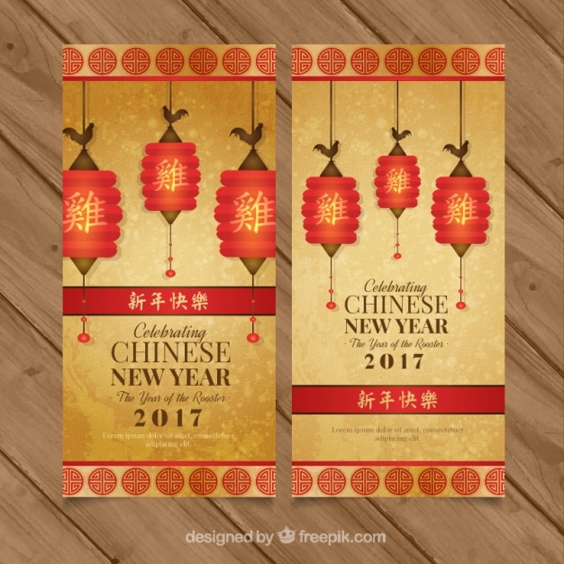 Kostenloser Vektor goldene banner für das chinesische neujahr mit dekorativen laternen