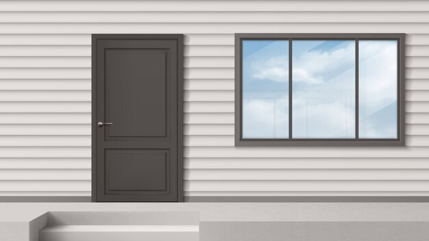 Hausfassade mit grauer Tür, Fenster, Abstellgleiswand