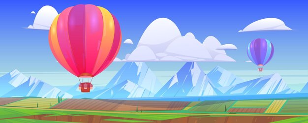 Heißluftballons fliegen über Berglandschaft mit grünen Wiesen und Feldern im Tal.